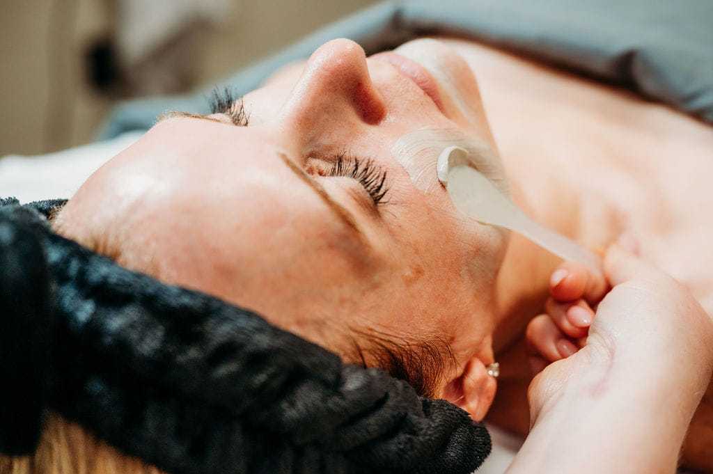 woman receiving a facial