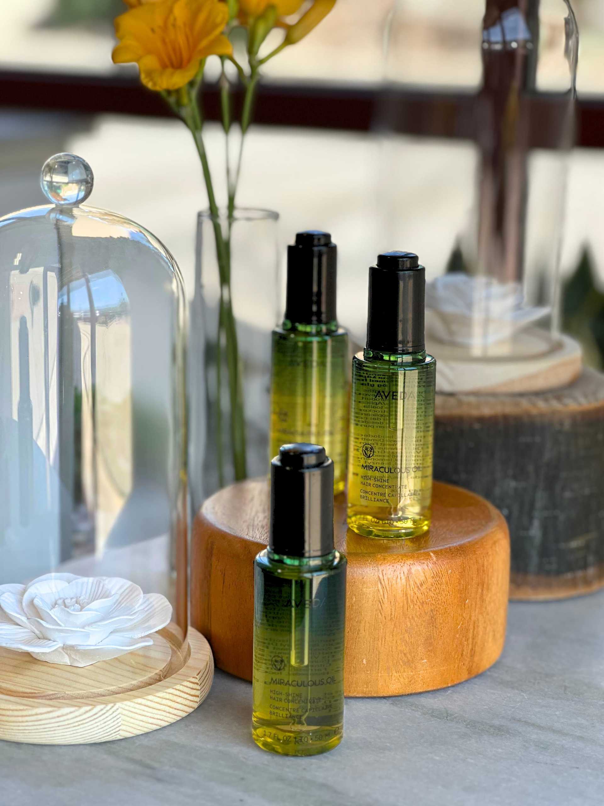 miraculous hair oil with white and yellow flowers