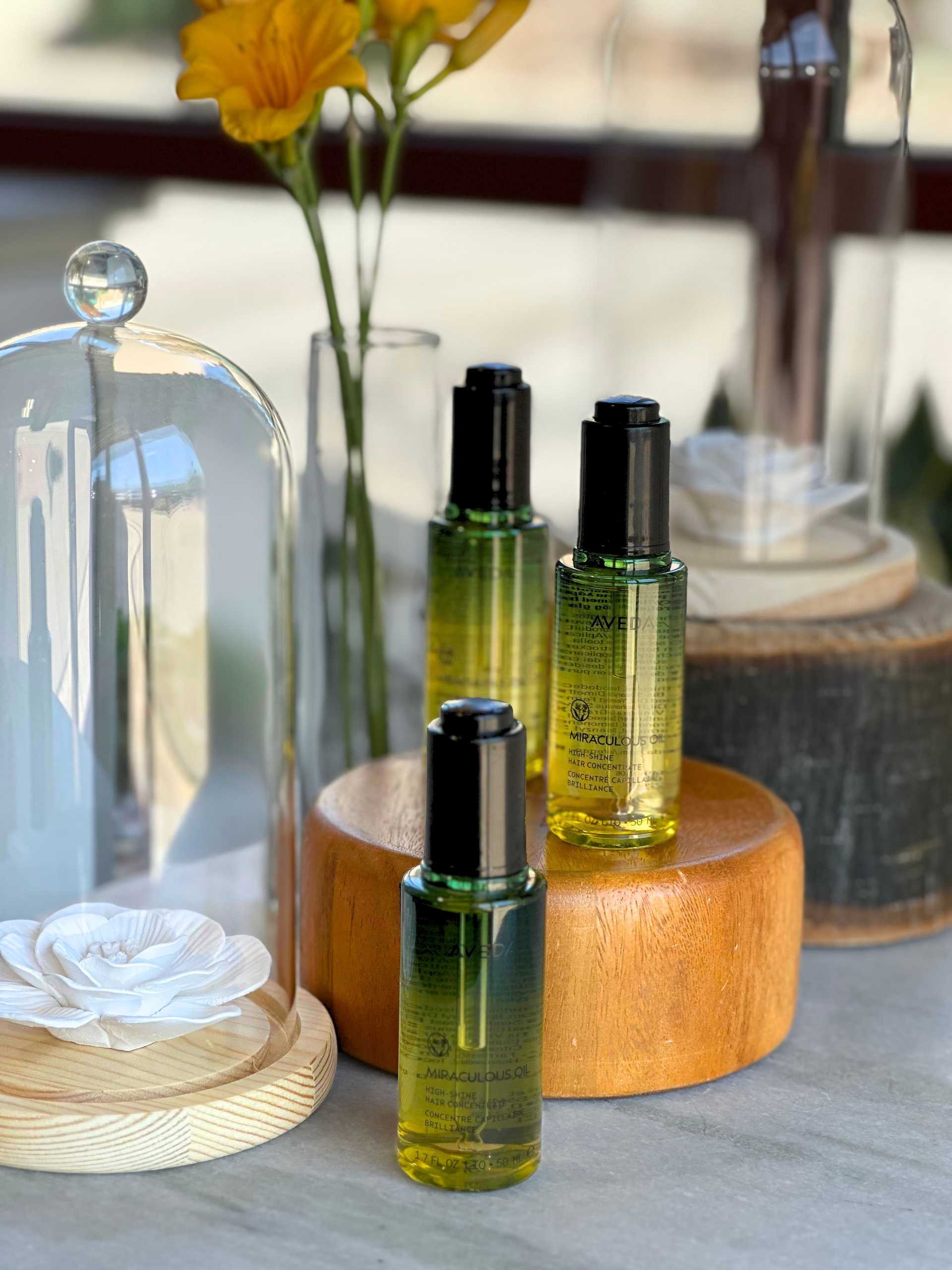 miraculous hair oil with white and yellow flowers